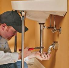 Plumber in Thornton repairs a sink's P-Trap